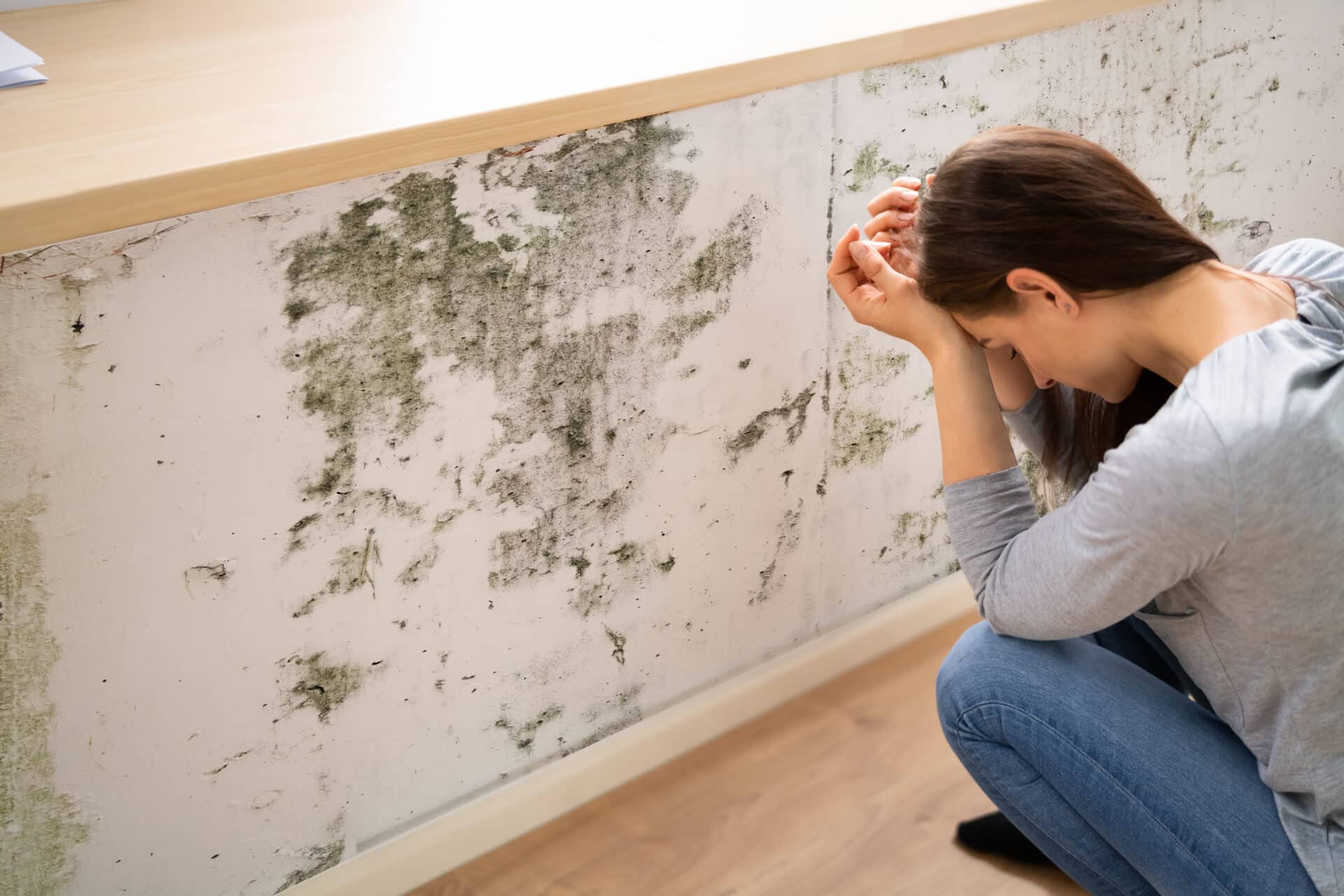 Shocked Woman Looking At Mold On Wall - ETC of Kentucky