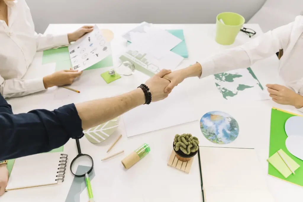 businessman-shaking-hands-with-his-partner-desk - ETC of Kentucky